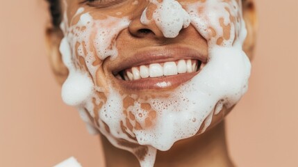 Naklejka premium Person applying foam to their face using hands.