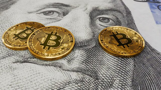 Golden crypto bitcoin coins on a 100 dollar bill featuring Benjamin Franklin