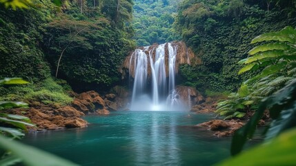 Fototapeta premium Tropical Waterfall In Lush Forest