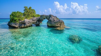 A beautiful blue ocean with a rock archway in the middle