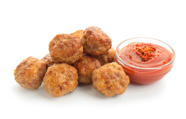 Pile of delicious meatballs and bowl with ketchup isolated on white