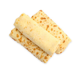 Three delicious rolled crepes isolated on white, top view