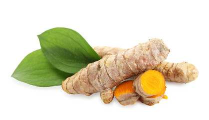 Tumeric rhizomes with leaves isolated on white