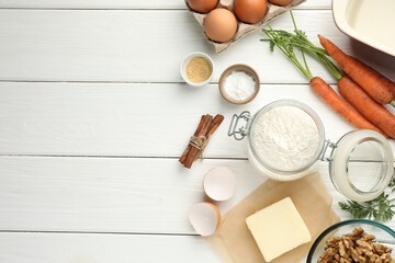 Different ingredients for making carrot cake on white wooden table, flat lay. Space for text
