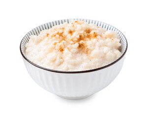 Tasty rice pudding with cinnamon isolated on white