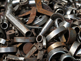 Scrap Metal Assemblage: A detailed shot of assorted scrap metal pieces, showcasing the textures and colors of discarded industrial elements, creating an abstract and visually intriguing display.