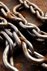 Fototapeta premium Rust and Resilience: A close-up showcases heavy-duty chains, a testament to strength and durability, with visible rust adding a touch of age and character.