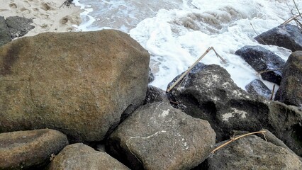 Panorama of beach with the natural coral stone and white sands during afternoon days without people.