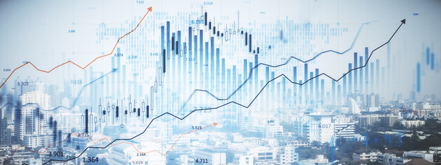 Real estate market growth concept with double exposure of cityscape and financial charts.