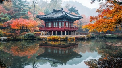 Fototapeta premium Autumnal Serenity: A Misty Reflection of Korean Pavilion