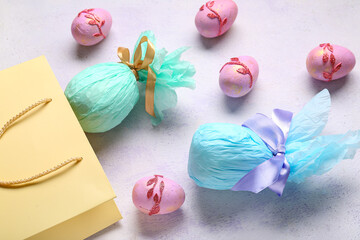 Shopping bag with Easter eggs on lilac grunge background