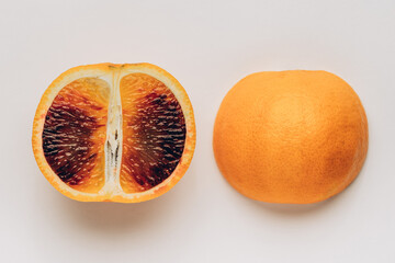 Sliced Spanish Orange Halves on White Background with Vibrant Flesh