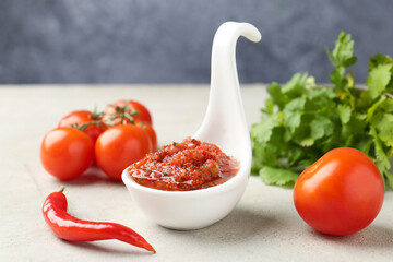 Delicious salsa sauce and ingredients on light textured table, closeup