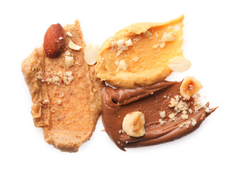 Different nut butters and nuts isolated on white, top view