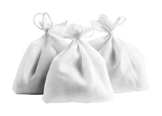 Fabric pouches filled with herbs for natural remedy use during wellness retreats or holistic therapy sessions, cut out