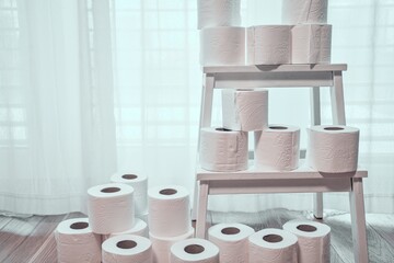Large Stack of Toilet Paper Rolls Indoors