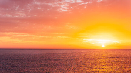 beautiful sunrise or sunset seascape with amazing calm sea water with waves and colorful amazing cloudy morning sky on background