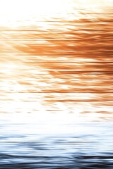 abstract fluid motion background with warm golden and cool blue tones, creating a blurred wallpaper resembling water reflections at sunset and sunrise
