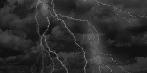 Thunder, lightnings and rain on a stormy summer night in black and white. Lightning bolts in the sky at night. 
