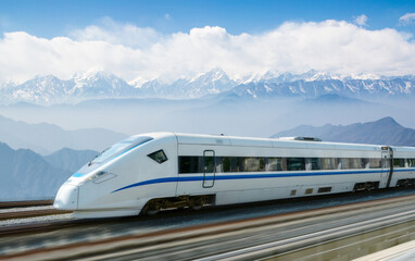 The high-speed train passes through the snow capped mountains © onlyyouqj