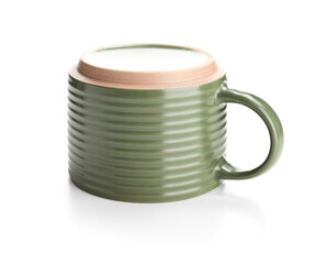 Green ceramic mug on white background