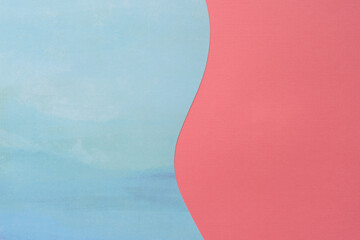 cut blue scrapbooking paper with wavy line and pink paper