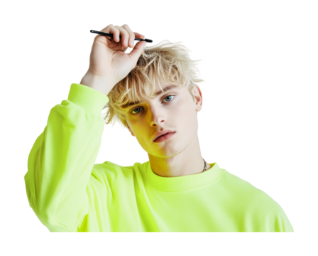 Young man in bright green sweatshirt holding a pencil in his hand and looking thoughtfully into the distance showcasing a creative idea, cut out