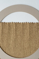 gold crepe paper with sawtooth edge and millboard crafting ring on blank paper