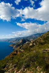 The sea and mountains are landscaped with clouds and sunny weather. Mirador de Cerro gordo