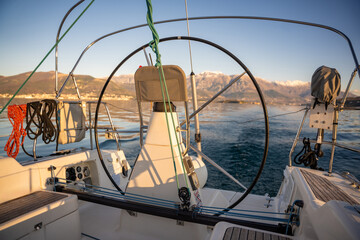 Helm of sailboat during a journey by sea in winter time in Montenegro
