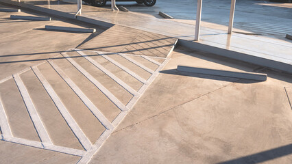 Ramp way and sidewalk in car parking lot area outside of shopping mall © Prapat