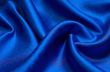 Obraz premium Luxurious smooth blue silk fabric with elegant folds and rich texture