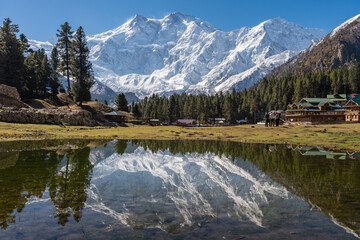 Stunning reflection of Nanga Parbat, the world's ninth-highest mountain, captured in a pristine...