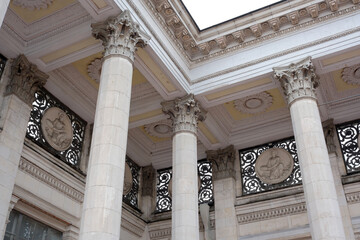 Intricate architectural details beneath a historic building facade