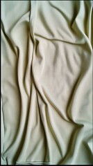 Obraz premium Silk Fabric Drapes: A close-up captures the luxurious texture of elegant fabric, gracefully draped in soft folds, in a studio environment.