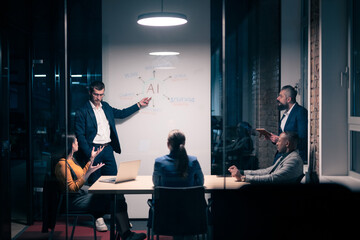 Diverse business team in modern office during a late-night meeting. Professional discussion on...