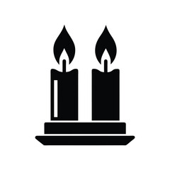 Obraz premium burning candle on a black background