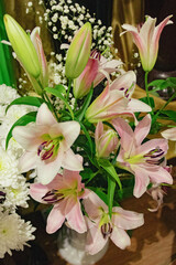 Obraz premium Roses – Elegant and romantic flowers symbolizing love and passion. Lilies – Graceful blooms known for their delicate fragrance and beauty.