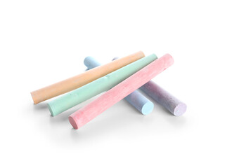 Pieces of colorful chalks on white background