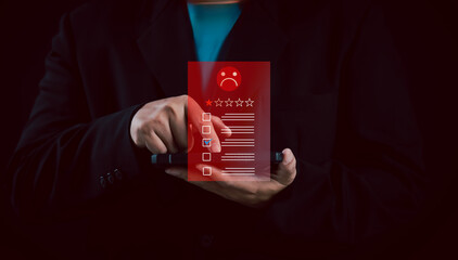 businessman submits a negative online review on a smartphone, featuring a low rating and a sad face icon, symbolizing poor customer experience, dissatisfaction, and the impact of negative feedback.