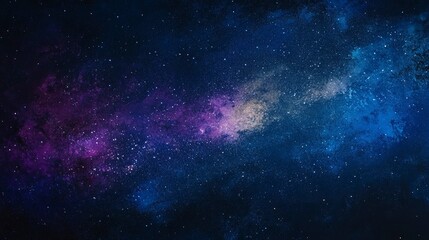 Obraz premium A starry night sky painted with an array of colors, showcasing the Milky Way galaxy and distant stars. The background is dark blue with hints of purple