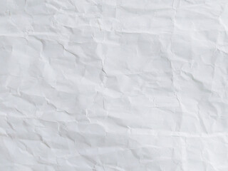 Crumpled white paper texture background. Recycled white craft paper with abstract shapes that can be used as text. White vintage paper with an antique texture.