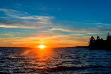 Fototapeta premium Summer evening sky-water landscape of sunset.