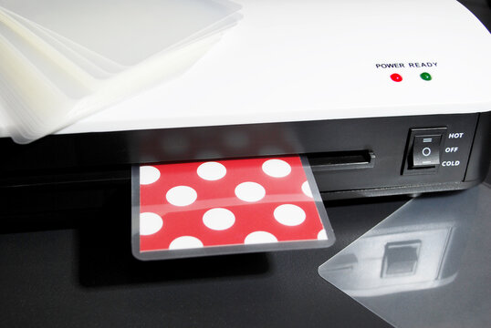 the process of laminating colored paper in a laminator