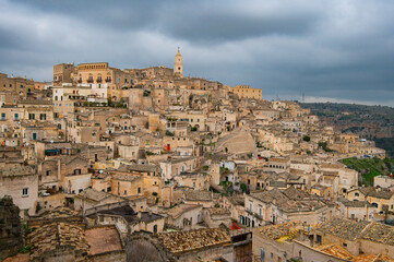 Naklejka premium Panoramic view of the ancient town of Matera (Sassi di Matera), Basilicata, Italy. Troglodyte settlement, Cave Houses. UNESCO world heritage site. Travel photography