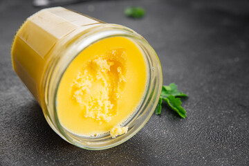 Ghee butter or clarified butter delicious gourmet food background on the table rustic food top view copy space keto and paleo diet vegetarian and vegan food