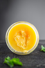 Ghee butter or clarified butter delicious gourmet food background on the table rustic food top view copy space keto and paleo diet vegetarian and vegan food