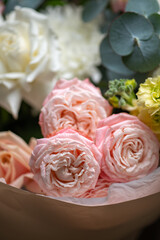 Delicate white and pink roses close up
