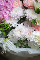 Delicate composition of white and pink roses in a basket