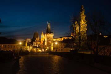 Fototapeta premium Night view of Charles Bridge in capital of Czech Republic Prague. The world famous Prague landmark with beautiful lightening. Long exposure night photo 
